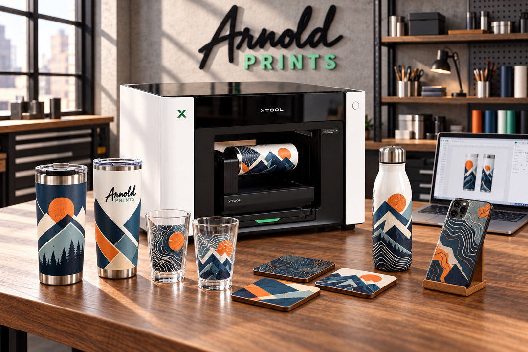 xTool O1 UV printer with full color UV printed tumblers, phone cases and coasters at Arnold Prints