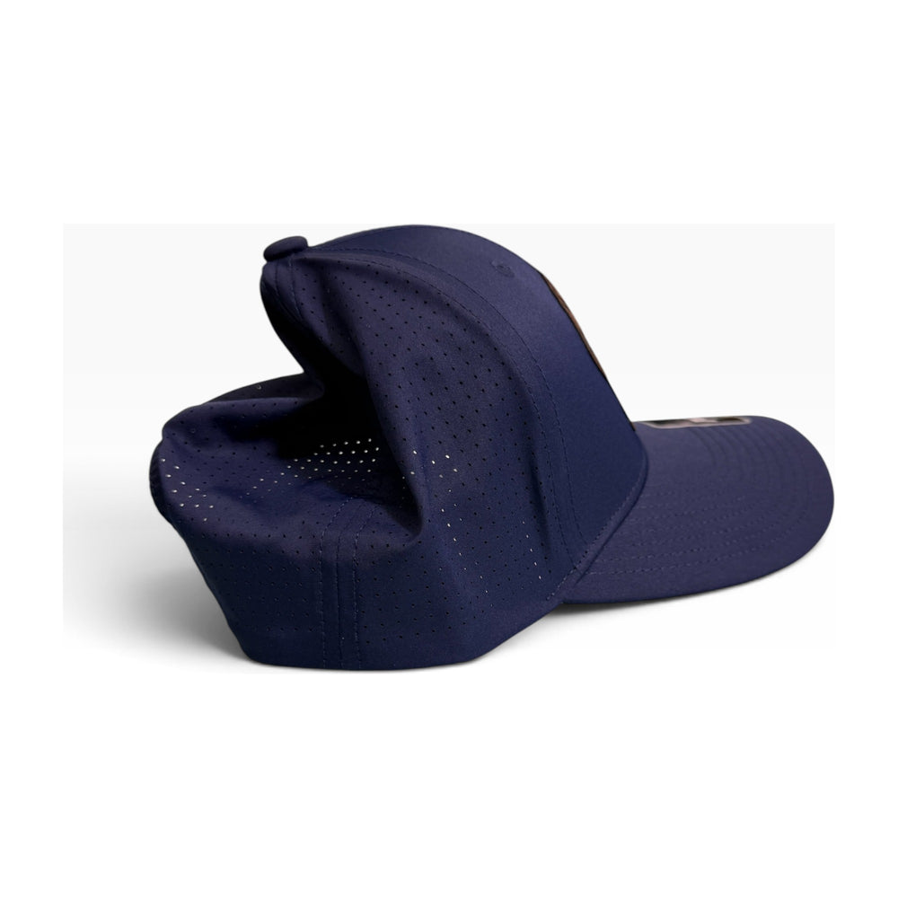 Sport-Tek STC65 Pro-Cut navy cap side profile with laser cut ventilation panels