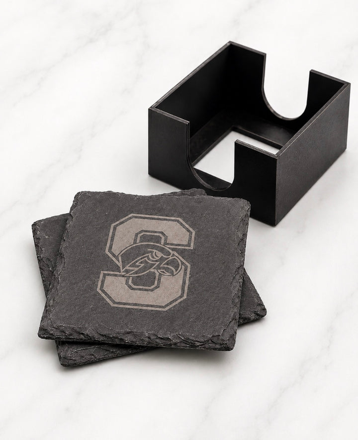 Seminole Ridge Hawks slate coasters laser-engraved with the S and hawk logo, shown with the included black coaster holder